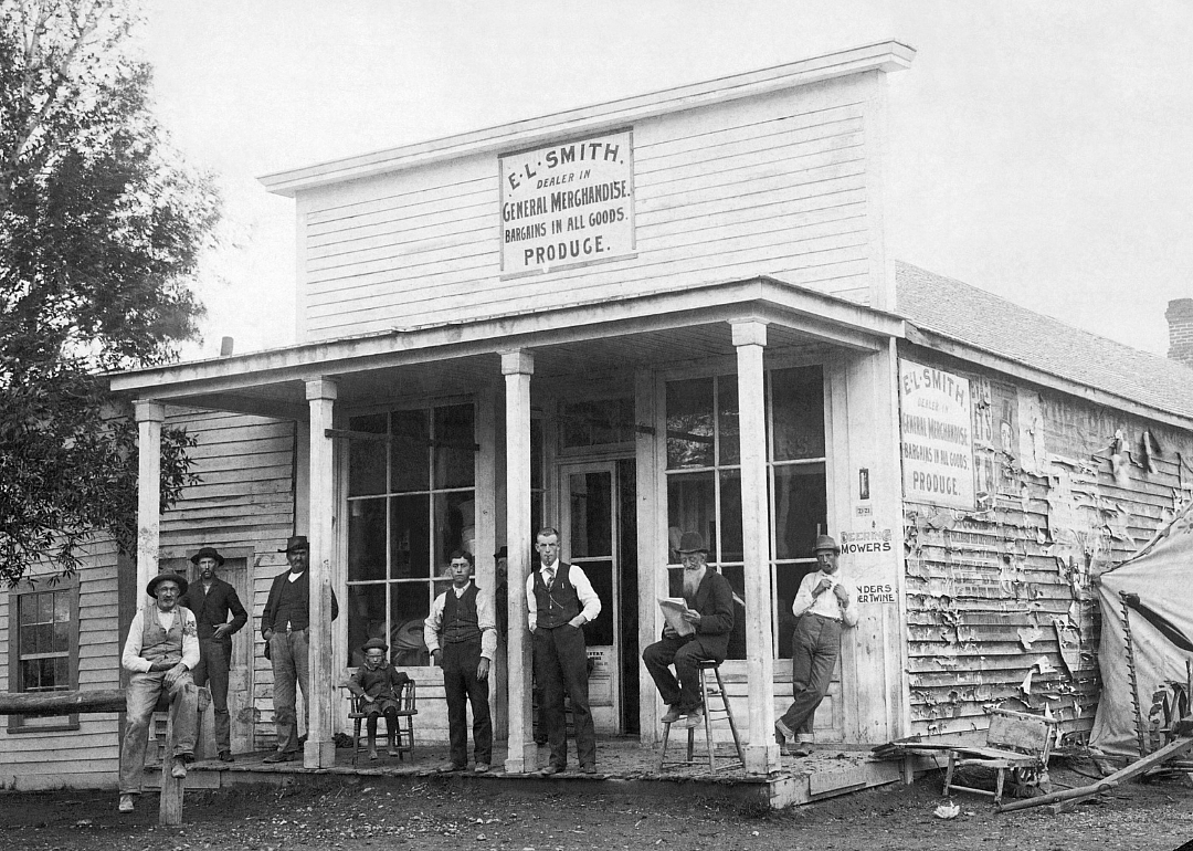 Men on steps of rural General Store